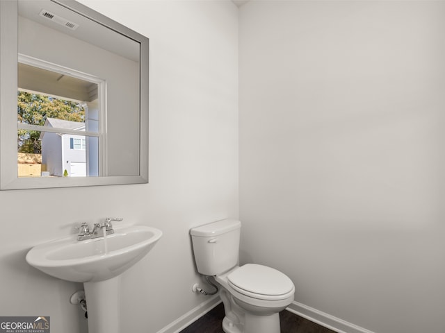 8230 Coldstream Dr, Fairburn, GA 30213 - bathroom featuring baseboards and wood finished floors