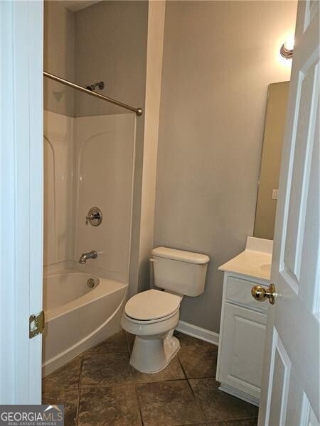 full bath with vanity, baseboards, shower / bathtub combination, and toilet