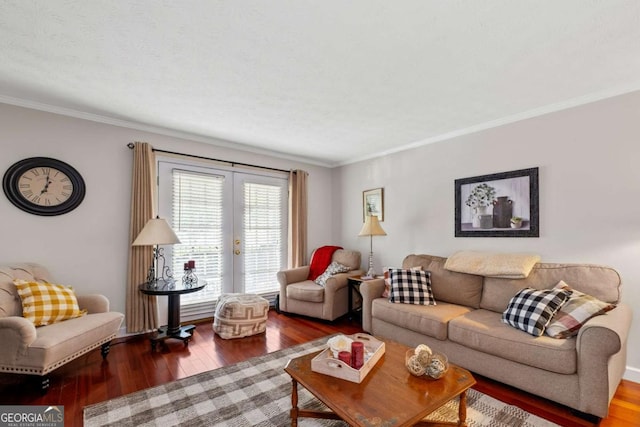 living area featuring hardwood / wood-style floors and crown molding