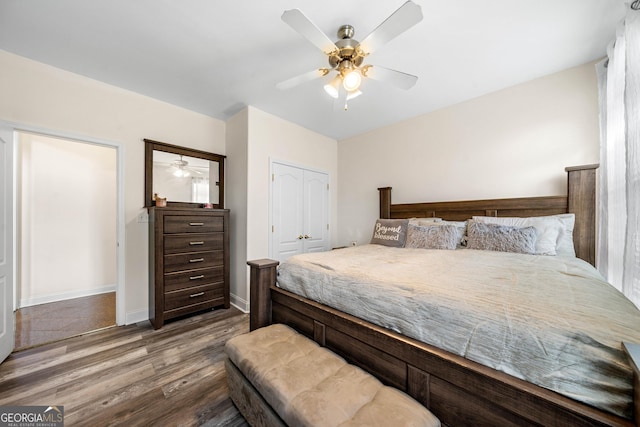 209 Braemar Ct, Mcdonough, GA 30253 - bedroom with ceiling fan, a closet, and wood finished floors