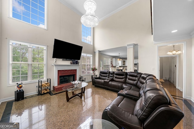209 Braemar Ct, Mcdonough, GA 30253 - living room with crown molding, baseboards, plenty of natural light, and a notable chandelier