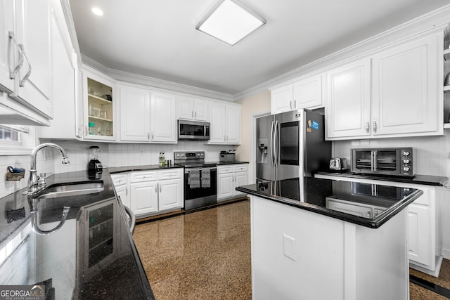 209 Braemar Ct, Mcdonough, GA 30253 - kitchen featuring a sink, appliances with stainless steel finishes, white cabinets, and a toaster