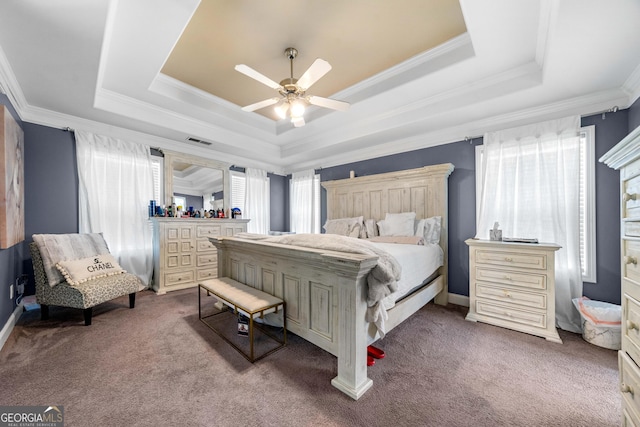 209 Braemar Ct, Mcdonough, GA 30253 - carpeted bedroom featuring visible vents, crown molding, baseboards, ceiling fan, and a raised ceiling