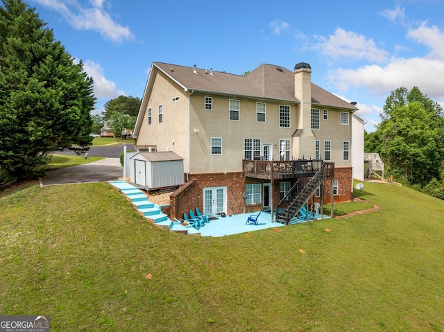 209 Braemar Ct, Mcdonough, GA 30253 - back of property featuring a deck, a patio area, stairway, a shed, and stucco siding