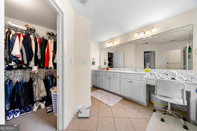 209 Braemar Ct, Mcdonough, GA 30253 - bathroom with tile patterned floors, visible vents, vanity, and a spacious closet