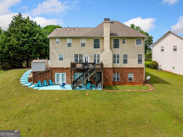 209 Braemar Ct, Mcdonough, GA 30253 - rear view of property with a deck, stucco siding, brick siding, a patio area, and stairway