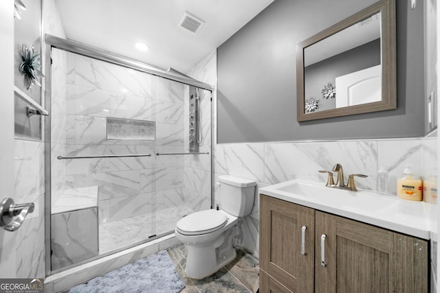 209 Braemar Ct, Mcdonough, GA 30253 - bathroom with visible vents, vanity, marble finish floor, toilet, and a marble finish shower