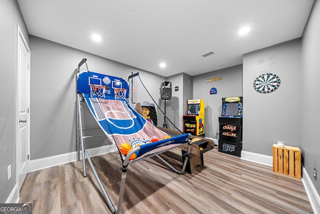 209 Braemar Ct, Mcdonough, GA 30253 - playroom with recessed lighting, baseboards, visible vents, and wood finished floors