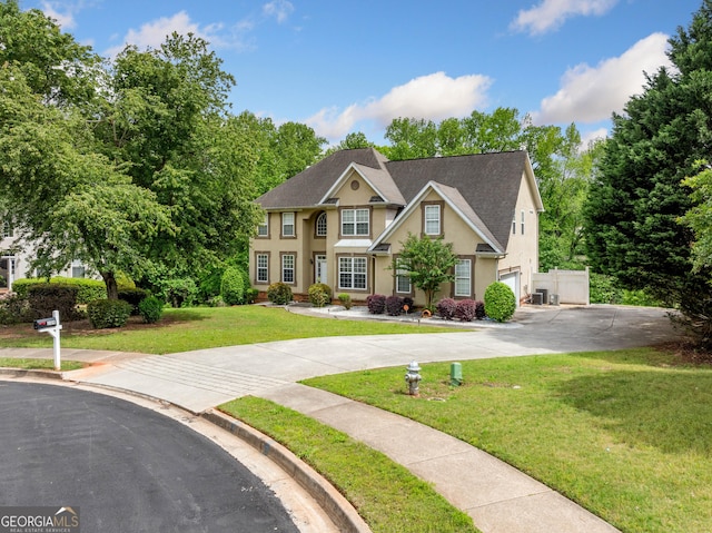 209 Braemar Ct, Mcdonough, GA 30253 - view of front facade with an attached garage, stucco siding, driveway, and a front yard