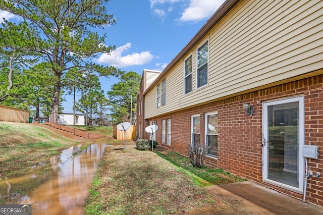 3162 Citrus Ct, Decatur, GA 30034 - view of side of property with a storage shed, brick siding, and an outbuilding