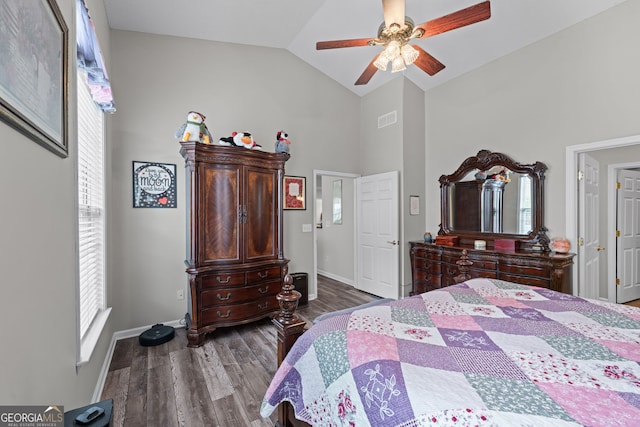 bedroom with high vaulted ceiling, a ceiling fan, visible vents, baseboards, and dark wood finished floors