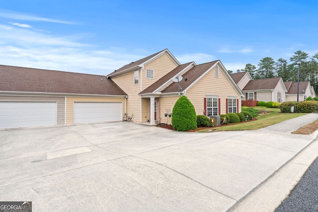traditional home with concrete driveway and a garage