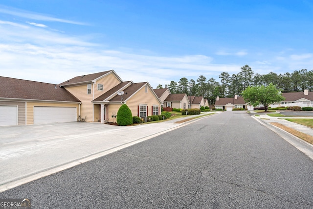 view of street featuring curbs, sidewalks, and a residential view