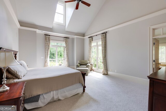 carpeted bedroom with high vaulted ceiling and a ceiling fan