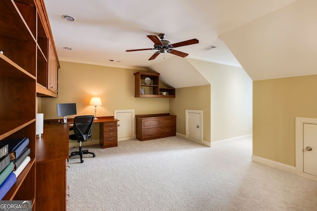 office area featuring ceiling fan, carpet floors, baseboards, ornamental molding, and vaulted ceiling