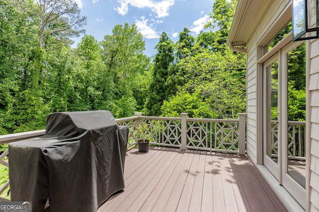 wooden terrace with area for grilling