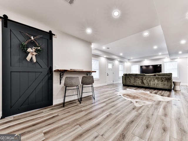 1141 Addington Ln, Waleska, GA 30183 - interior space with wood finished floors, a barn door, recessed lighting, and baseboards