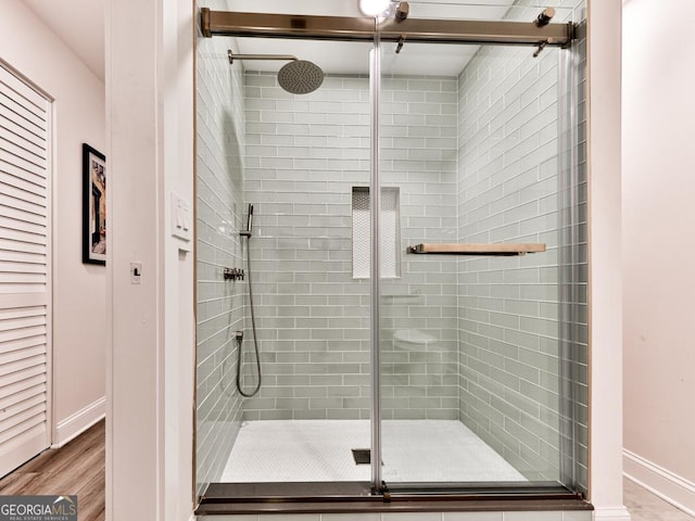 1141 Addington Ln, Waleska, GA 30183 - full bath with wood finished floors, a shower stall, and baseboards