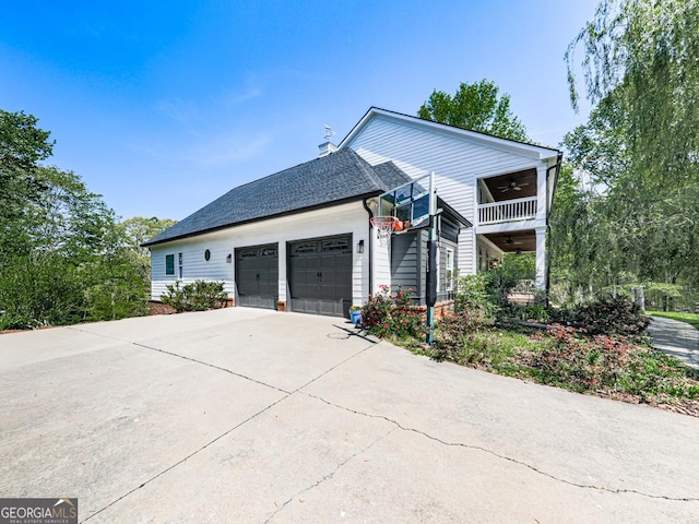 1141 Addington Ln, Waleska, GA 30183 - view of side of property with a garage, a balcony, ceiling fan, driveway, and a chimney