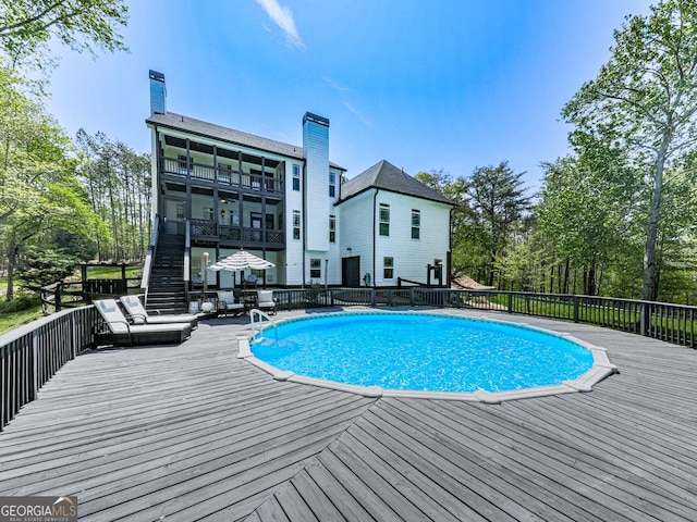 1141 Addington Ln, Waleska, GA 30183 - view of swimming pool with stairway, a wooden deck, and a fenced in pool