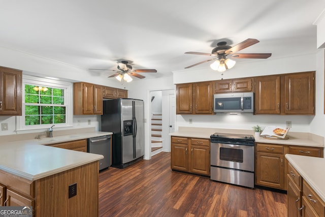 1440 Sandford Trl SW, Lilburn, GA 30047 - kitchen featuring ceiling fan, a sink, light countertops, dark wood-style floors, and stainless steel appliances