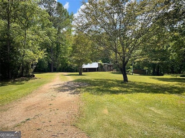 exterior space with driveway and a front yard