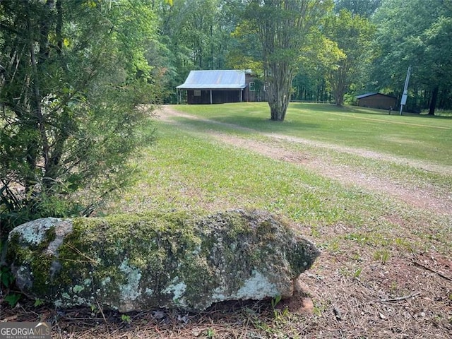 view of yard with a forest view