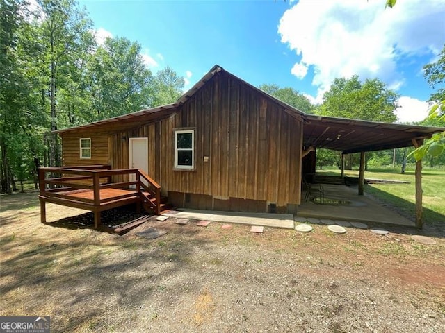 exterior space with a deck, a patio area, and crawl space