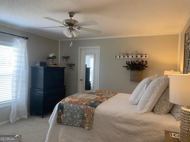 196 SE Stembridge Rd SE, Milledgeville, GA 31061 - carpeted bedroom with ornamental molding and ceiling fan