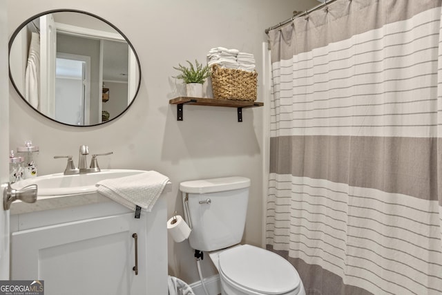 196 SE Stembridge Rd SE, Milledgeville, GA 31061 - bathroom featuring toilet, a shower with curtain, and vanity