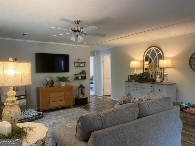 196 SE Stembridge Rd SE, Milledgeville, GA 31061 - living area with ornamental molding, ceiling fan, and wood finished floors