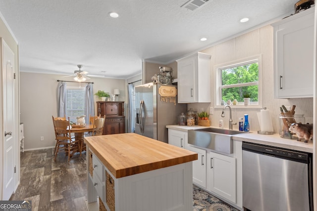 196 SE Stembridge Rd SE, Milledgeville, GA 31061 - kitchen with dark wood-style flooring, visible vents, a sink, stainless steel appliances, and butcher block countertops