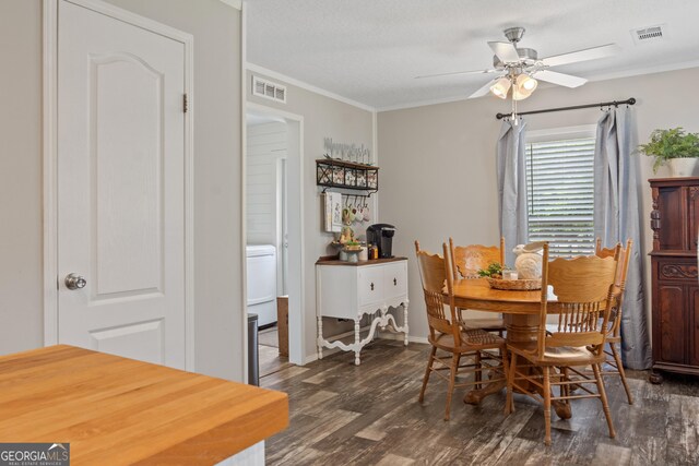 196 SE Stembridge Rd SE, Milledgeville, GA 31061 - dining area featuring crown molding, dark wood-type flooring, and visible vents