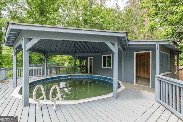 wooden deck with an outdoor pool