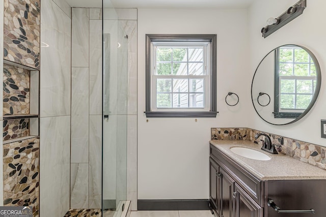 bathroom featuring a shower stall, tile patterned flooring, and vanity