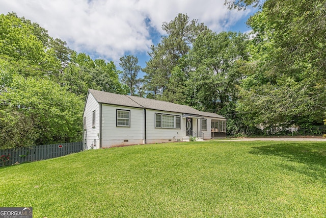 single story home with crawl space, fence, and a front yard