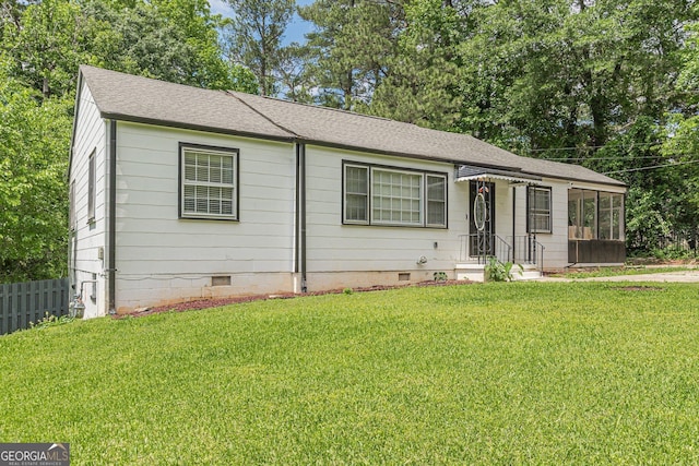 ranch-style house with crawl space, fence, a shingled roof, and a sunroom