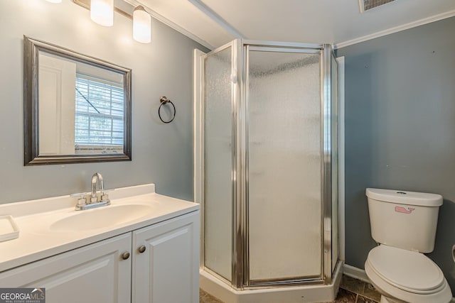full bath with vanity, a stall shower, and toilet