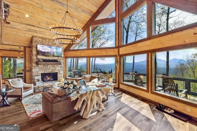 194 Blue Sky Overlook, Blue Ridge, GA 30513 - living area featuring wooden ceiling, a chandelier, a wealth of natural light, a mountain view, and high vaulted ceiling