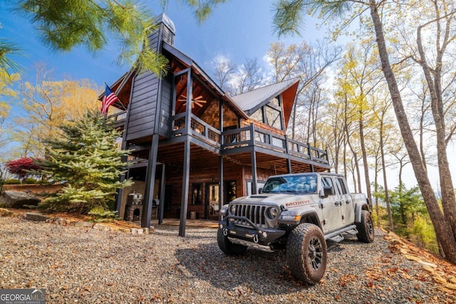 194 Blue Sky Overlook, Blue Ridge, GA 30513 - back of house with a deck, metal roof, and a chimney