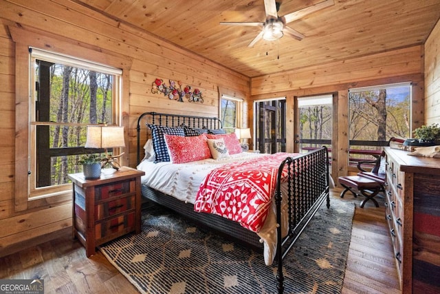 283 Blue Sky Overlook, Blue Ridge, GA 30513 - bedroom with wood-type flooring, multiple windows, wood walls, and wood ceiling