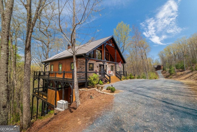 283 Blue Sky Overlook, Blue Ridge, GA 30513 - view of home's exterior with a chimney, gravel driveway, and a deck