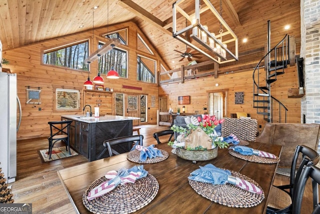 283 Blue Sky Overlook, Blue Ridge, GA 30513 - dining space featuring light wood-style flooring, wood ceiling, wood walls, stairway, and a ceiling fan