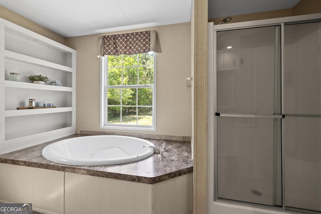 1173 N Ga Highway 21, Springfield, GA 31329 - bathroom featuring a stall shower, a bath, plenty of natural light, and built in features