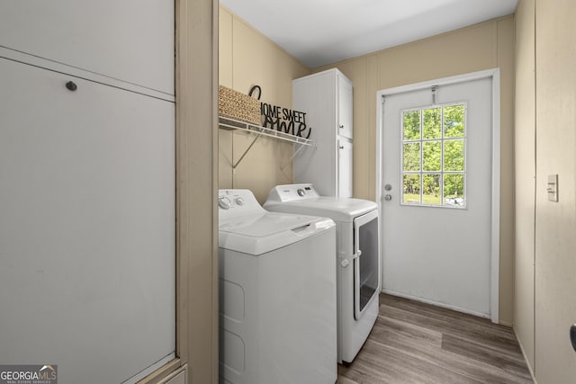 1173 N Ga Highway 21, Springfield, GA 31329 - laundry area with washer and clothes dryer, cabinet space, and light wood-type flooring