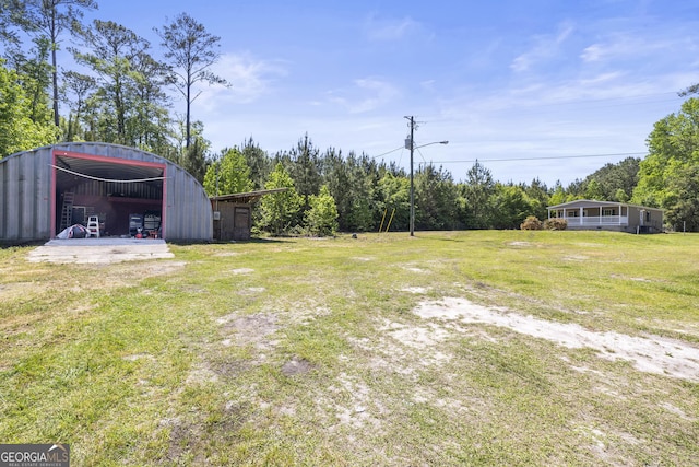1173 N Ga Highway 21, Springfield, GA 31329 - view of grassy yard with a pole building and an outdoor structure
