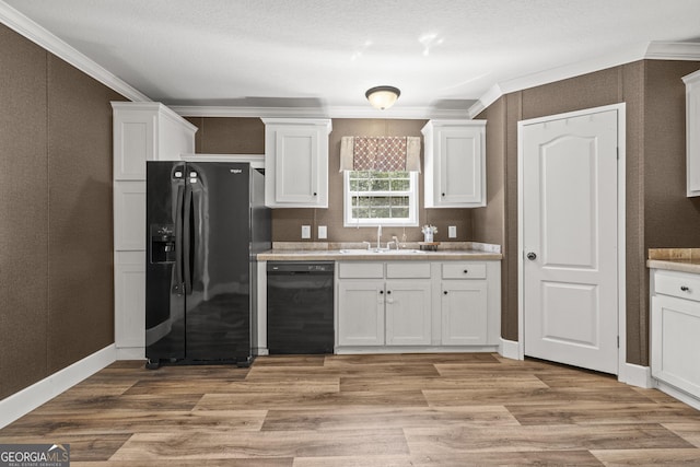 1173 N Ga Highway 21, Springfield, GA 31329 - kitchen featuring black appliances, white cabinets, light countertops, light wood finished floors, and crown molding