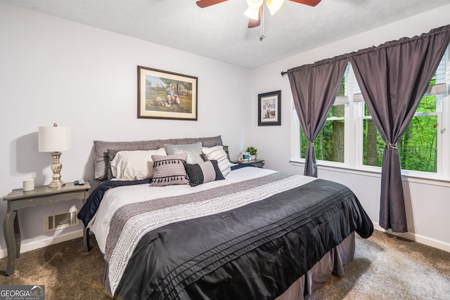 bedroom featuring carpet floors, baseboards, ceiling fan, and visible vents