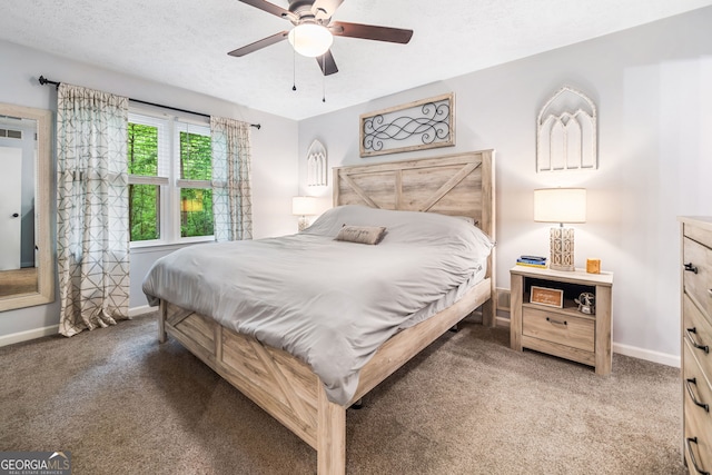 carpeted bedroom featuring baseboards and ceiling fan