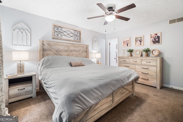 bedroom featuring visible vents, carpet floors, baseboards, a textured ceiling, and a ceiling fan